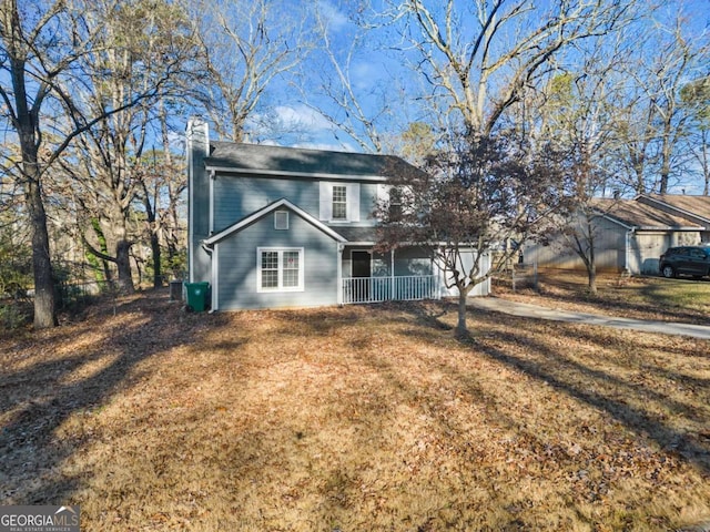 view of front of home featuring a porch and a front lawn