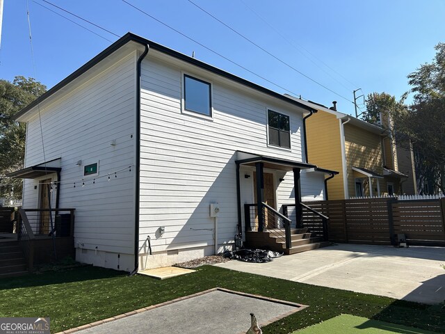 back of house with a patio area