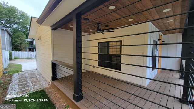 view of side of home featuring ceiling fan