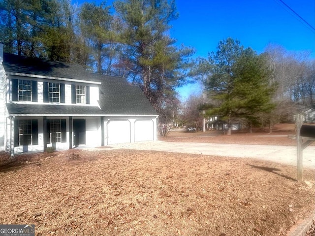 view of front facade with covered porch and a garage