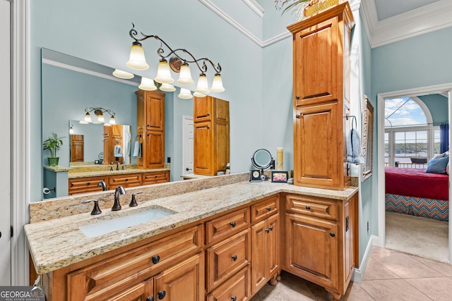 bathroom with vanity, tile patterned flooring, and crown molding