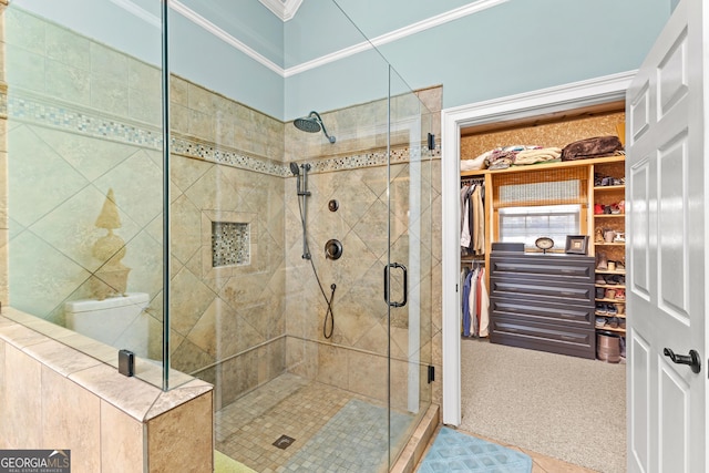 bathroom with crown molding and walk in shower