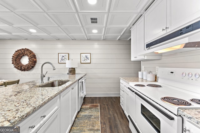 kitchen with white cabinets, white electric range, dark hardwood / wood-style flooring, sink, and light stone counters