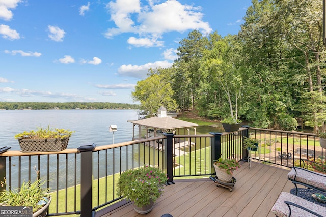 deck featuring a water view and a yard