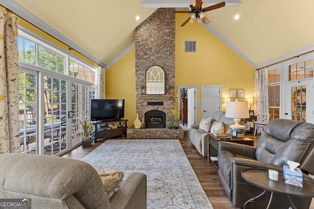 living room with dark wood-type flooring, french doors, a stone fireplace, and high vaulted ceiling