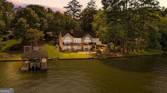 aerial view at dusk with a water view