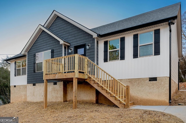 back of house with a wooden deck