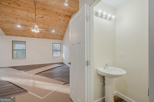 bathroom featuring ceiling fan, wood ceiling, vaulted ceiling, and hardwood / wood-style flooring