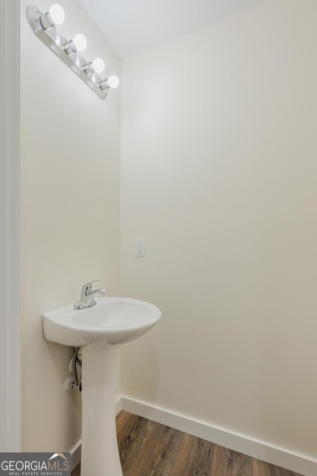 bathroom with hardwood / wood-style flooring