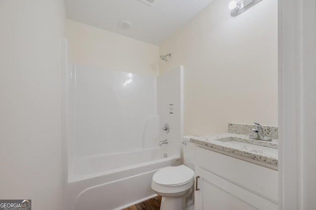 full bathroom featuring wood-type flooring, vanity, toilet, and shower / washtub combination