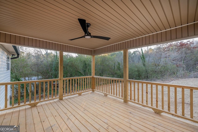 wooden deck featuring ceiling fan