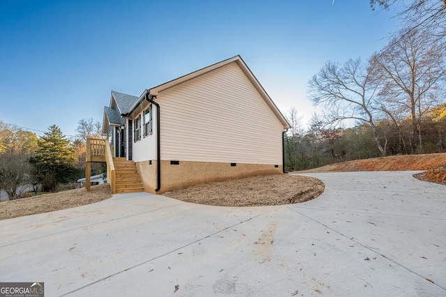 view of side of home featuring a deck