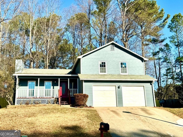 view of front property featuring a porch and a garage