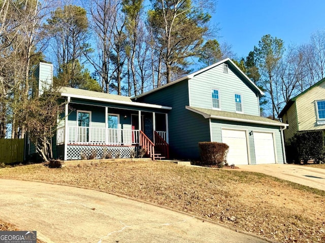 view of front of house with covered porch and a garage