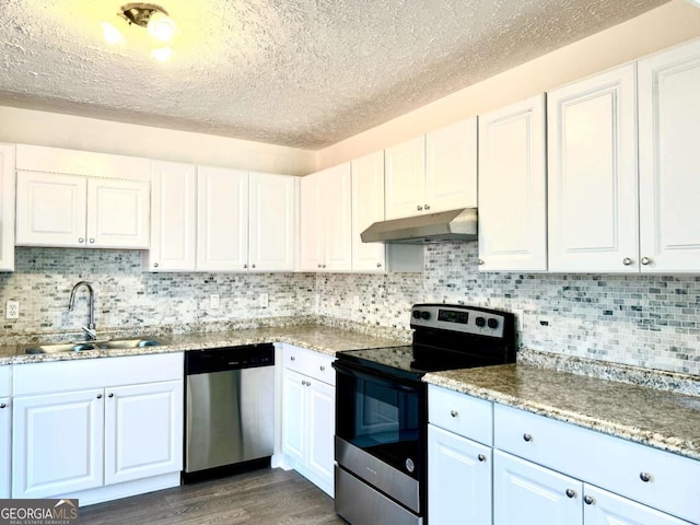 kitchen featuring stainless steel appliances, white cabinetry, and sink