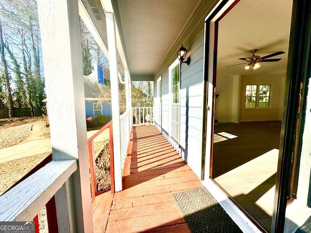 exterior space featuring ceiling fan and a porch