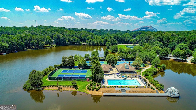 birds eye view of property with a water view