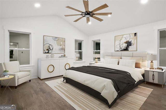 bedroom with dark wood-type flooring, ceiling fan, and lofted ceiling