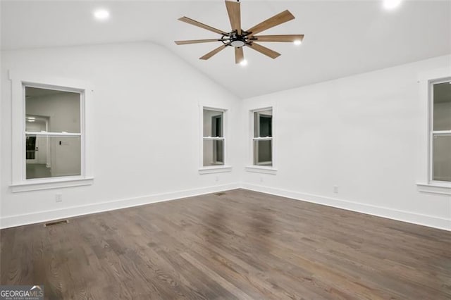 spare room featuring ceiling fan, dark hardwood / wood-style floors, and lofted ceiling