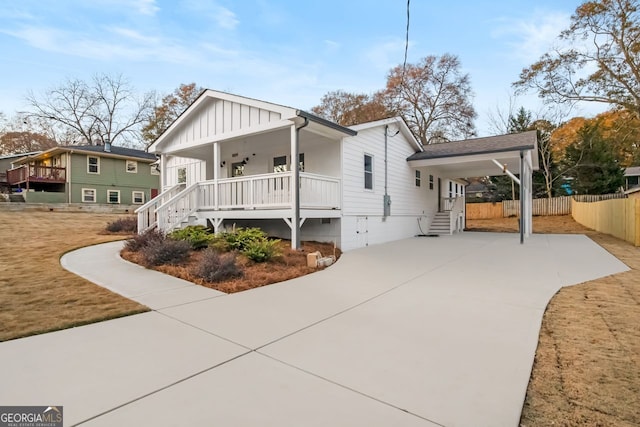 view of front of property with a carport and a porch