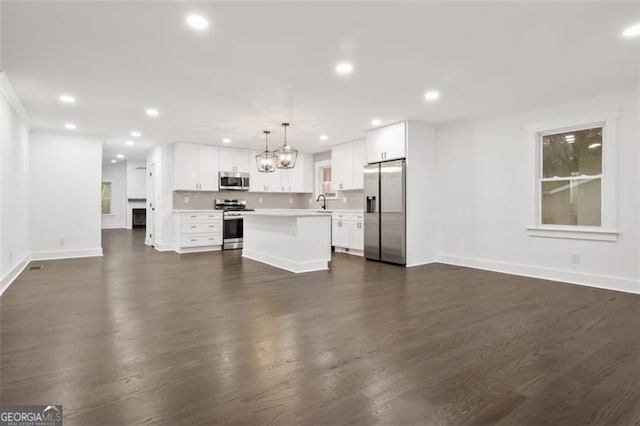 unfurnished living room featuring dark hardwood / wood-style floors and an inviting chandelier