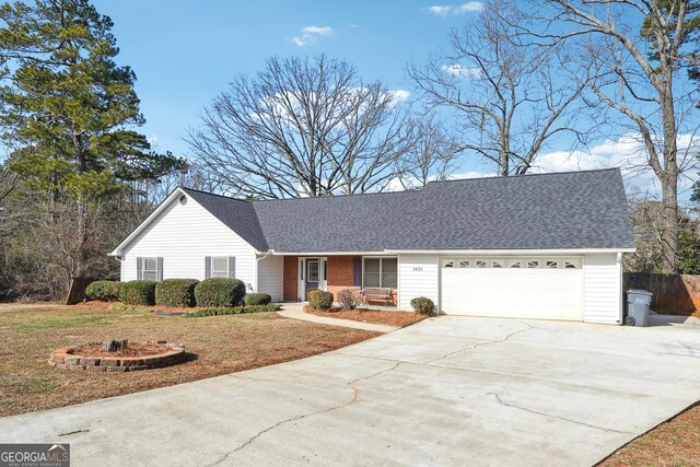 single story home featuring a front yard and a garage