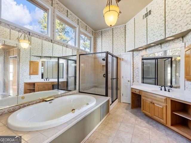 bathroom featuring tile patterned floors, vanity, and independent shower and bath