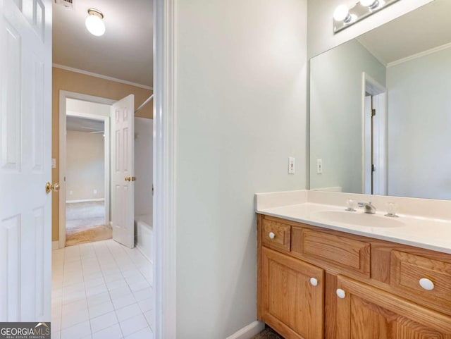 bathroom with tile patterned floors, vanity, and ornamental molding