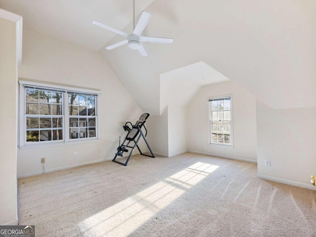 additional living space with ceiling fan, light colored carpet, and lofted ceiling