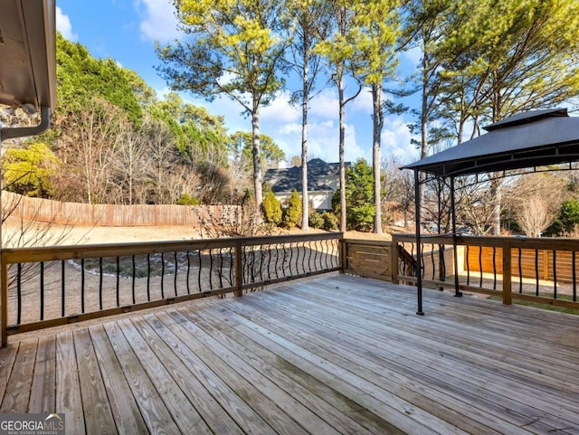 wooden deck featuring a gazebo