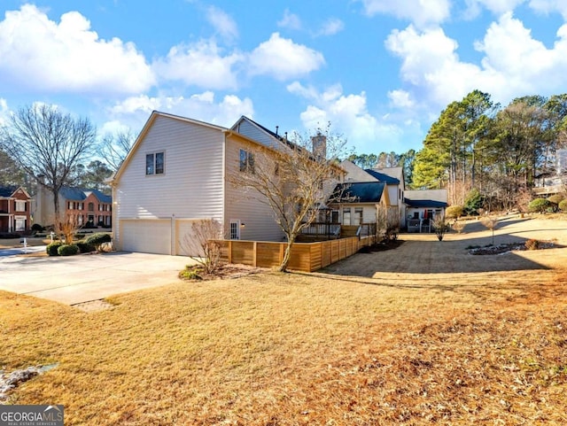 view of side of property with a garage