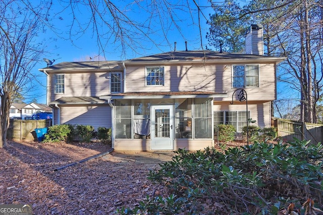 view of front of property featuring a sunroom