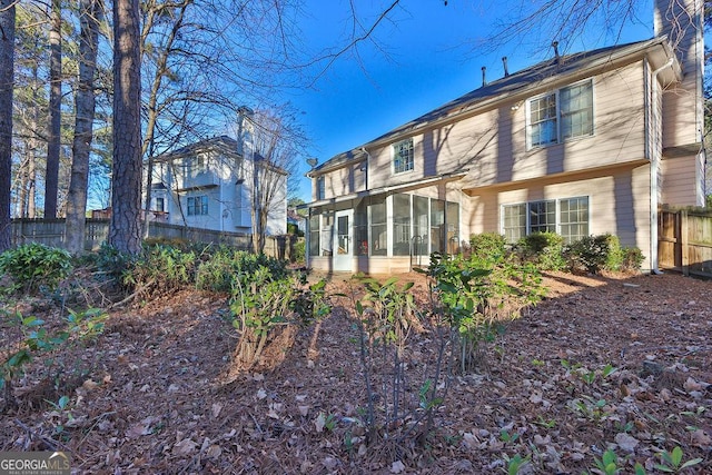 back of property featuring a sunroom