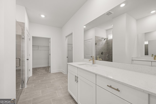 bathroom with vanity and an enclosed shower