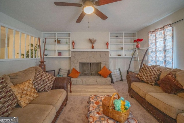 living room with a fireplace and ceiling fan