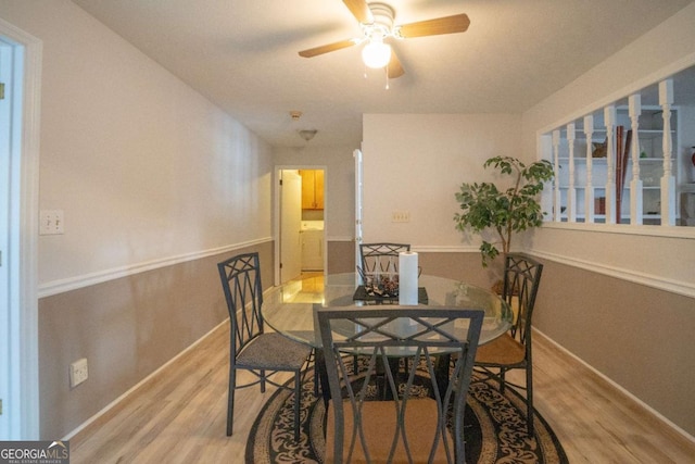 dining space featuring ceiling fan and light wood-type flooring