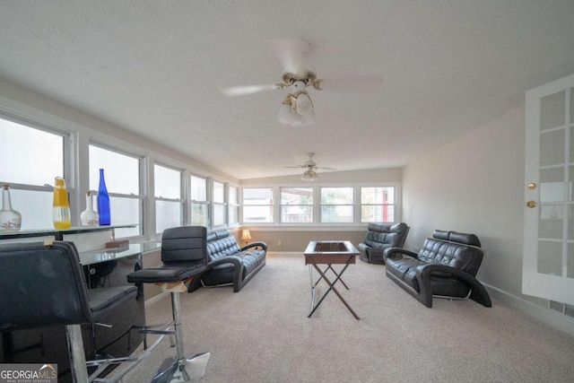 carpeted living room featuring a textured ceiling, ceiling fan, and vaulted ceiling