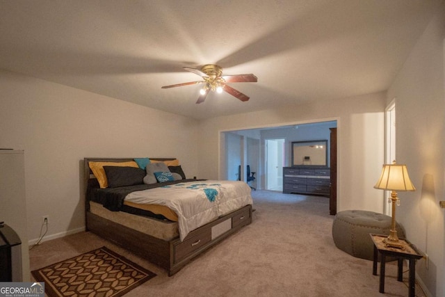 bedroom with light colored carpet and ceiling fan