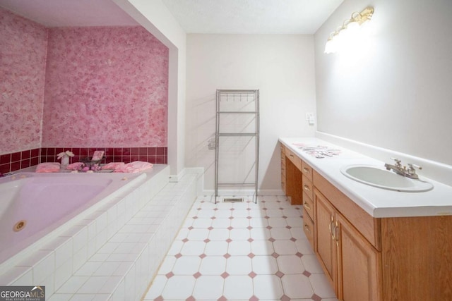 bathroom with vanity and a relaxing tiled tub