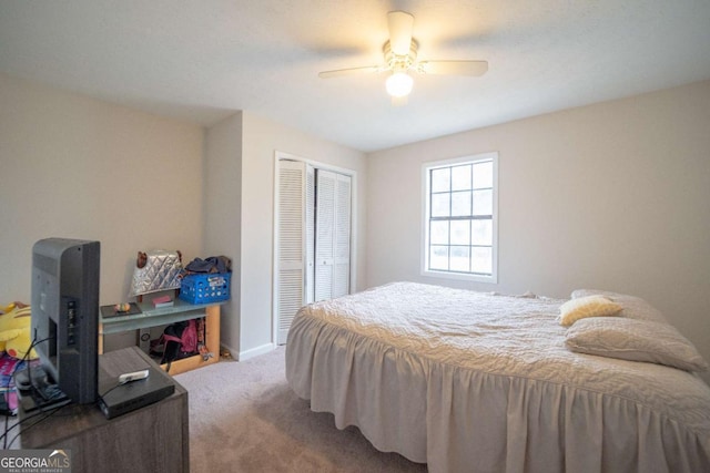 bedroom with carpet floors, a closet, and ceiling fan