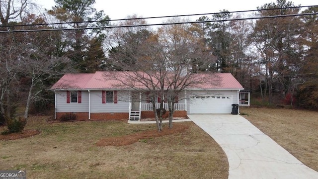 ranch-style house featuring a porch, a garage, and a front lawn