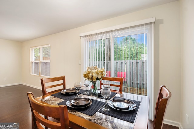257 Country Club Dr, Jonesboro, GA 30238 - dining space with dark wood-style floors and baseboards