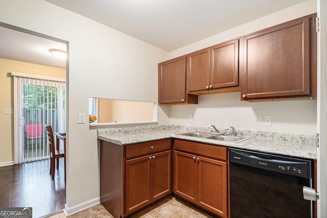 257 Country Club Dr, Jonesboro, GA 30238 - kitchen with black dishwasher, a sink, light countertops, baseboards, and a peninsula