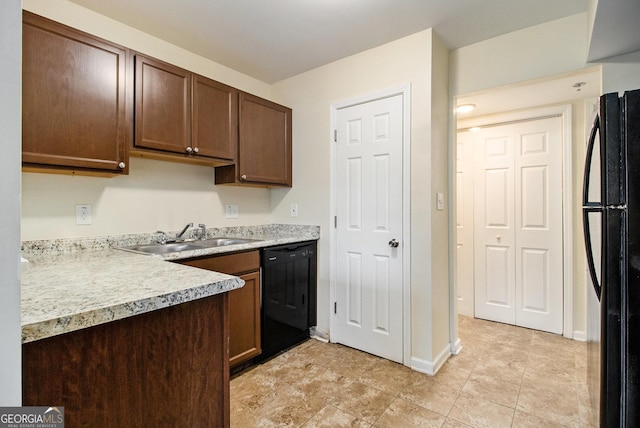 257 Country Club Dr, Jonesboro, GA 30238 - kitchen with black appliances, a sink, light countertops, baseboards, and dark brown cabinetry