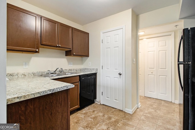 kitchen with sink and black appliances