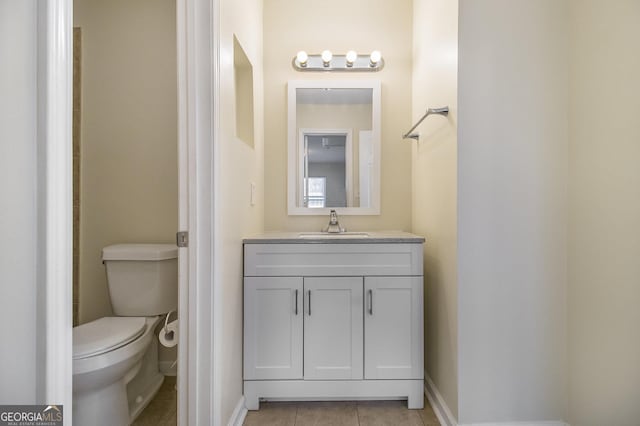 257 Country Club Dr, Jonesboro, GA 30238 - bathroom with toilet, tile patterned floors, baseboards, and vanity