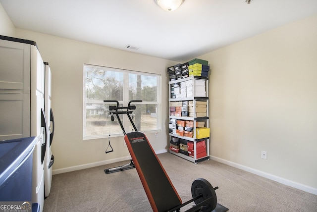 exercise room with light carpet