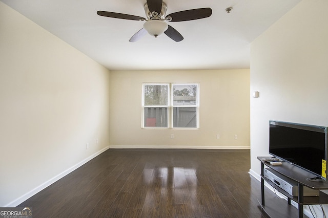 living room with ceiling fan and dark hardwood / wood-style floors