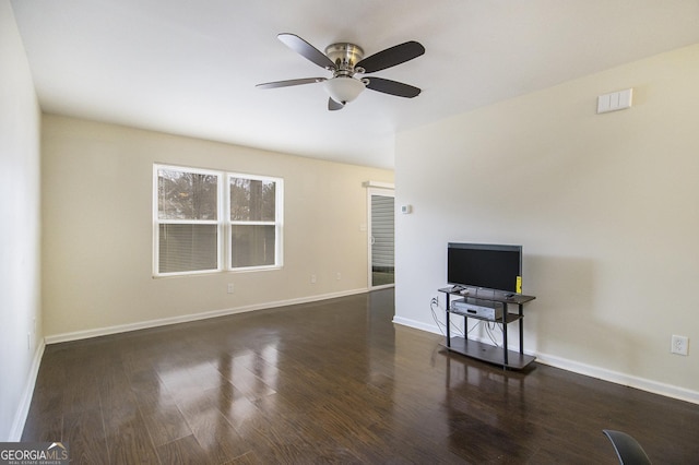 unfurnished living room featuring ceiling fan and dark hardwood / wood-style flooring