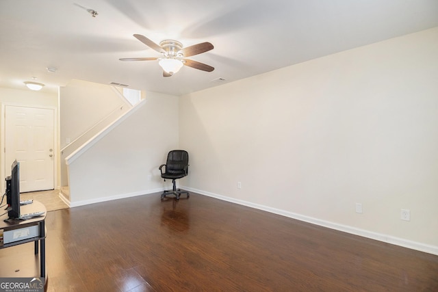 257 Country Club Dr, Jonesboro, GA 30238 - unfurnished living room featuring wood finished floors, a ceiling fan, stairway, and baseboards